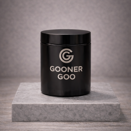 Black container labeled 'GOONER GOO' on a gray marble platform with a gray background